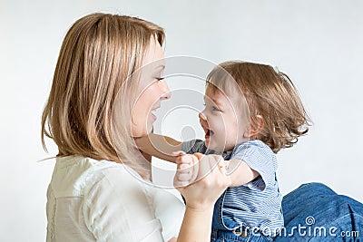 Mom and kid having fun pastime. Parenthood Stock Photo