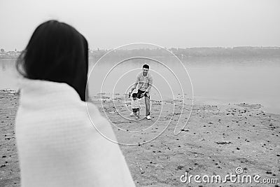 Mom looks at dad with a little boy Stock Photo