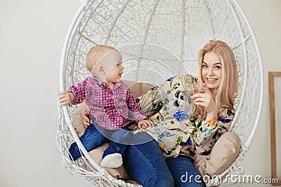 Mom plays with her little son and laughs. The concept of childhood, education, family Stock Photo