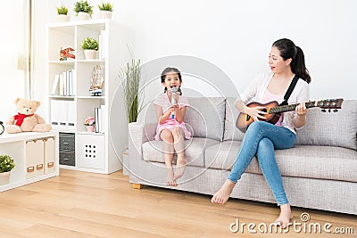 Mom and daughter perform together. Stock Photo