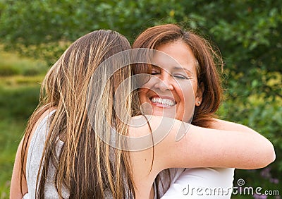 Mom Receiving Hug Stock Photo