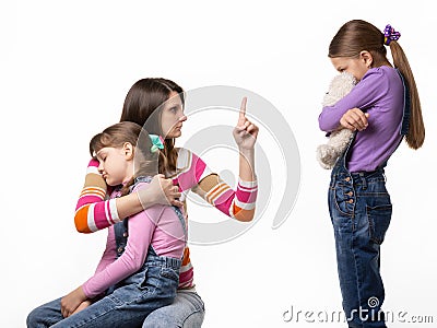 Mom talks hard with her daughter for offending her sister Stock Photo