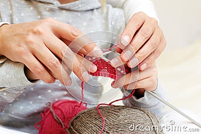 Mom teaches a child to knit. Stock Photo