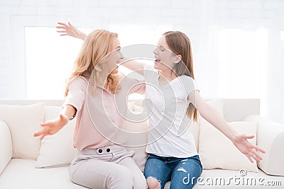 Mom and teenage daughter embrace. Stock Photo