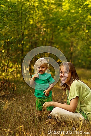 Mom and thoughful baby in nature Stock Photo