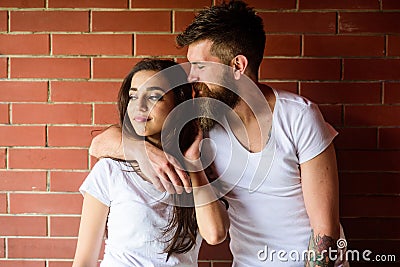 Moments of intimacy. Couple find place to be alone. Couple in love hugs brick wall background. Girl and hipster romantic Stock Photo