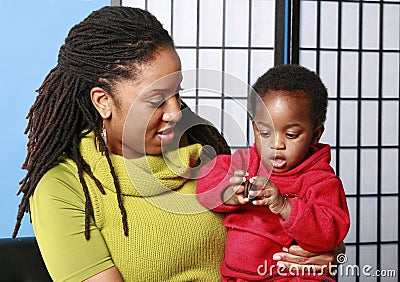 Mommy, baby and cookie Stock Photo