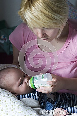 Mommy feeding baby Stock Photo