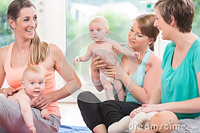 Moms and their babies practicing diaper change Stock Photo