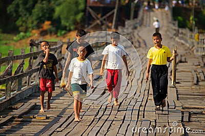 Mon refugee kids cross saphan mon wooden bridge Editorial Stock Photo