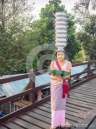 Mon woman, minority group in Thailand, showing her skill Editorial Stock Photo