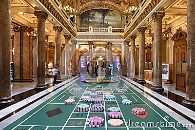 Monaco - June 20, 2019: Tourists inside the Monte Carlo Casino in Monaco Editorial Stock Photo