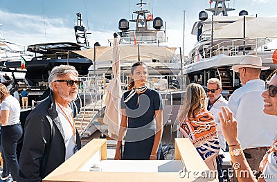 Monaco, Monte Carlo, 29 September 2022 - clients and yacht brokers look at the mega yachts presented, discuss the Editorial Stock Photo