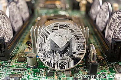 Monero coin on a technology circuit Editorial Stock Photo