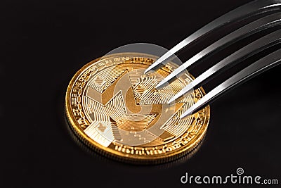 Monero crytocurrency coin under the fork Editorial Stock Photo