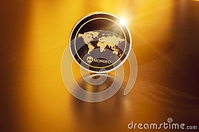 Monero icon. Gold Crypto currency BTC Bitcoin on black background. Golden Bit Coin virtual cryptocurrency or blockchain Editorial Stock Photo