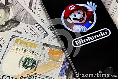 Money, Apple iPhone 6s with Super Mario Bros figure character fr Editorial Stock Photo