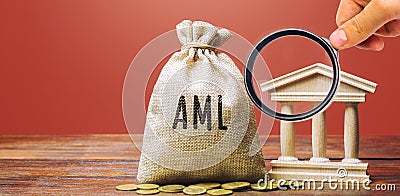 Money bag AML and bank building. Anti Money Laundering concept. Financial monitoring, Identification of suspicious transactions. Stock Photo