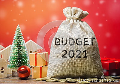 Money bag Budget 2021, Christmas tree, houses and gifts. Accumulating money and planning a budget. Business and finance. Loan, Stock Photo