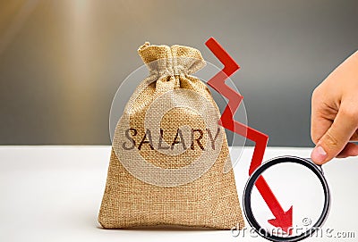 Money bag with the word Salary and arrow to down. lower salary, wage rates. demotion, career decline. lowering the standard of Stock Photo