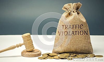 Money bag with the word Traffic violation and the judge`s hammer. Law. Court. Fine, legal fees. Traffic Tickets. Speeding. Failur Stock Photo