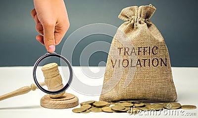 Money bag with the word Traffic violation and the judge`s hammer. Law. Court. Fine, legal fees. Traffic Tickets. Speeding. Failur Stock Photo