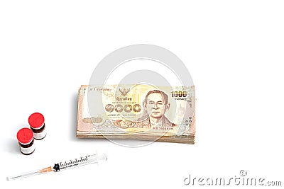 Money banknotes and syringe with medicine bottles on isolated white back ground in drug medicine ,care or kill concept Stock Photo