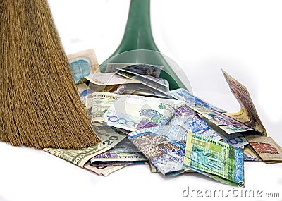 Money and broom Stock Photo