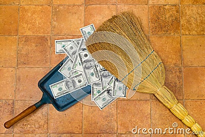 Money and broom Stock Photo