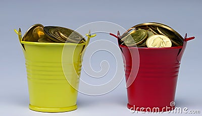 Money Buckets with Coins: A Visual Guide to Budgeting Stock Photo
