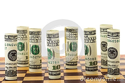 Money on chess board Stock Photo