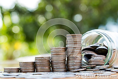 Money coin stack growing graph with mony jar Stock Photo