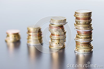 Money concept: Coins tacked on each other. Inflation, currency, savings, money Stock Photo
