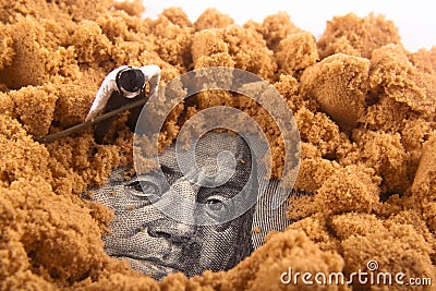 Money in the dirt Stock Photo