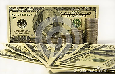 Money. Dollars and stack of coins on white background. Saving money concept. Growing business. Confidence in the future. Stock Photo
