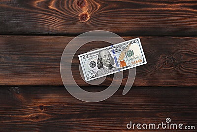 Money. Dollars on a wooden background Stock Photo