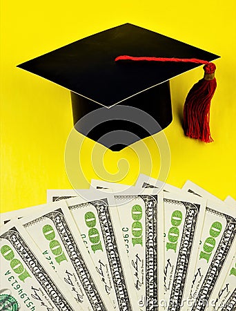 Money for education, diploma and academic cap of the student. Financial opportunity to save and spend on College or University Stock Photo