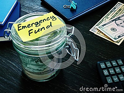 Money for Emergency fund in the glass jar. Stock Photo