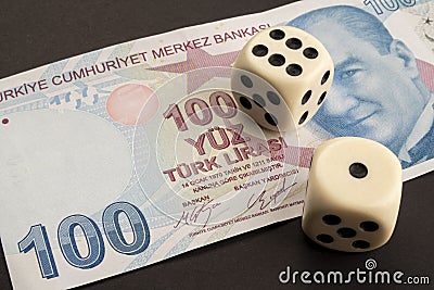 Close up on a Turkish 100 hundred TL. Dice on top showing 1 and 6 Stock Photo