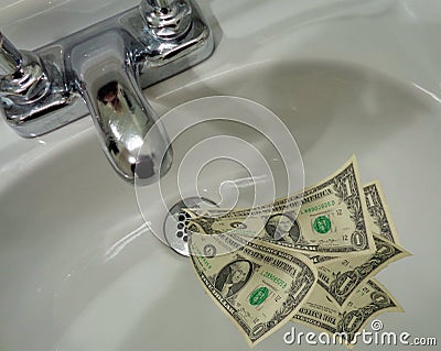 Money Going Down the Drain Stock Photo