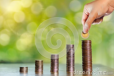 Money growth Saving money. Upper tree coins to shown concept of Stock Photo