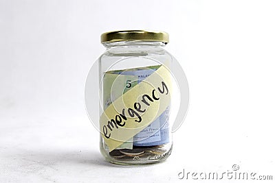 Money in jar ready for emergency Stock Photo