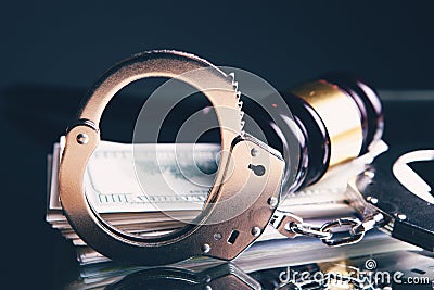 Money judge gavel and handcuffs Stock Photo