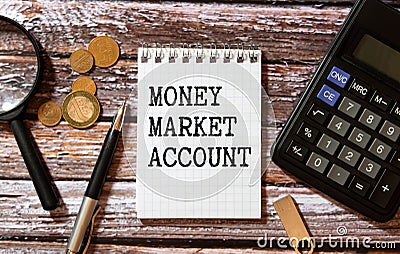 MONEY MARKET ACCOUNT written on paper with office tools and keyboard on grey background Stock Photo