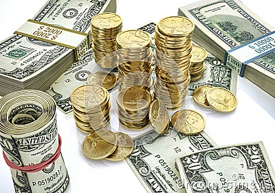 Money. Mixed wads of USD banknotes and some stacks of gold dollar coins Stock Photo