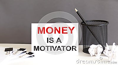 Money is a motivator text and office supplies, business concept Stock Photo