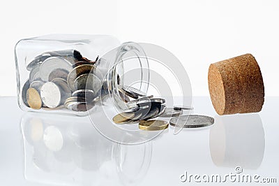 Money in a open glass jar Stock Photo