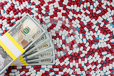 Money with pills Stock Photo