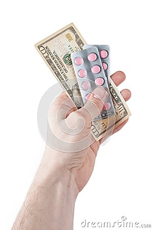 Money and pills in hand Stock Photo