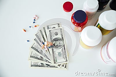 Money with pills and vitamins Stock Photo